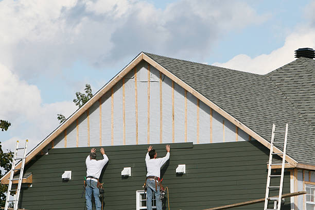 Professional Storm Damage Siding Repair technician working in Rogersville, PA